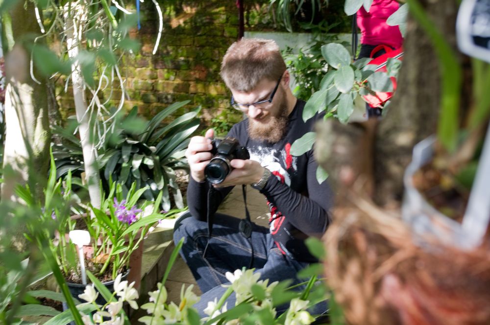 Fellow photographer catching the beauty of orchids